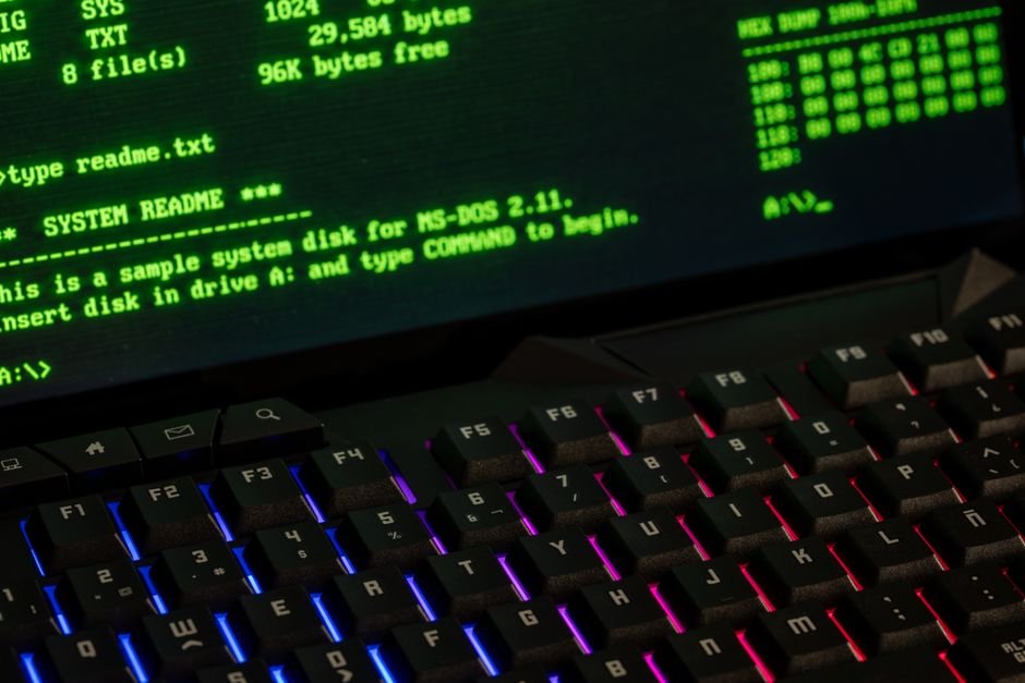 Retro computer screen showing command-line text, illustrating the registry commands that re-enable Smart App Control
