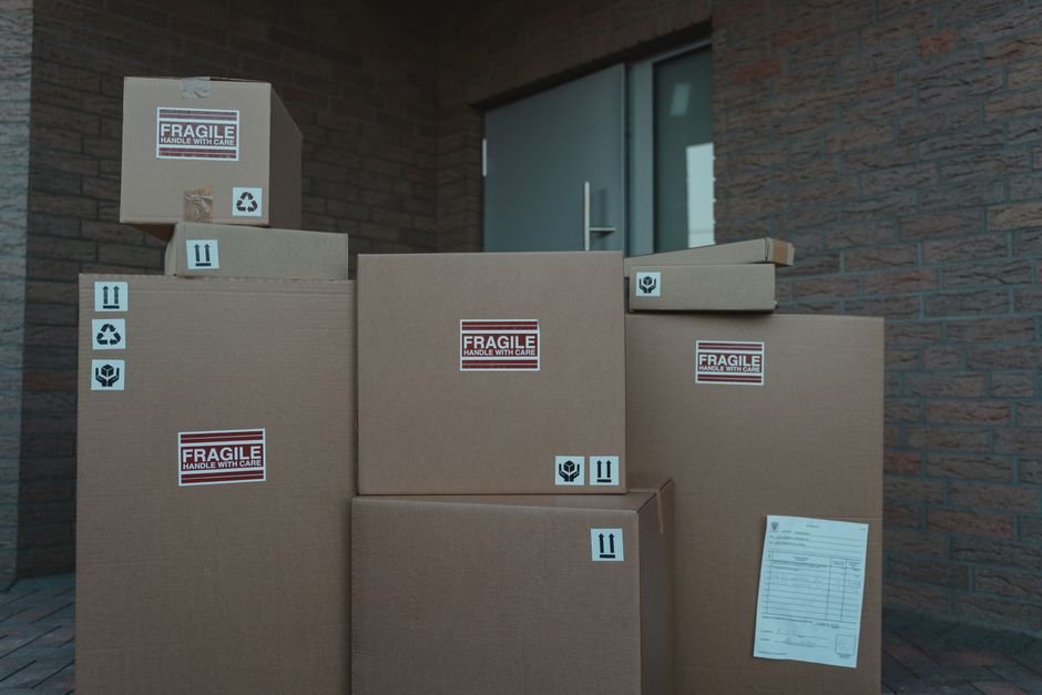 Stack of cardboard shipping boxes ready to be packed for a return