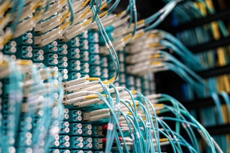 Network cables in a server rack representing a domain network