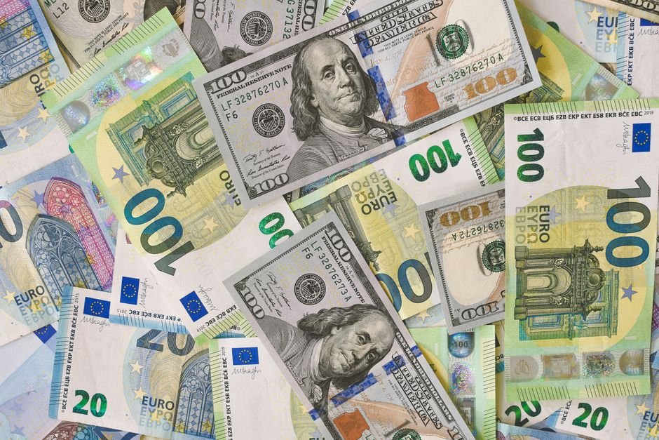 Euro and dollar banknotes representing a currency conversion on a card refund
