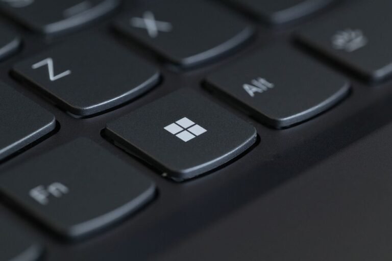 Close-up of a Windows laptop keyboard, illustrating how to remap the Copilot key to Right Ctrl in Windows 11