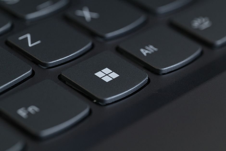 Close-up of a Windows laptop keyboard, illustrating how to remap the Copilot key to Right Ctrl in Windows 11