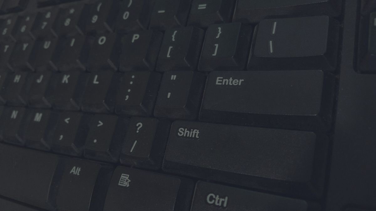 Close-up of a black computer keyboard used for Task Manager and display reset shortcuts