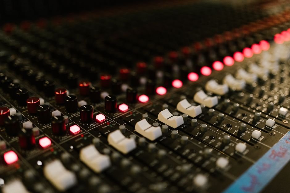 Audio mixing console with illuminated knobs connected to a PC over USB