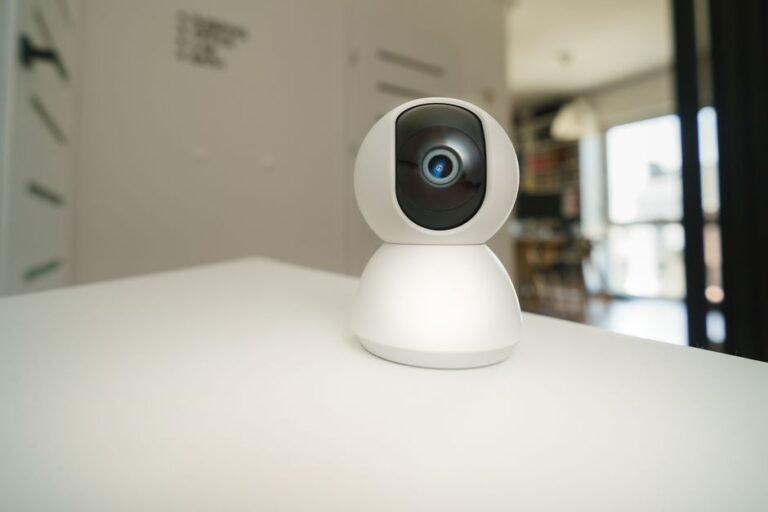 Smart home security camera on a table indoors, illustrating Wyze Indoor Cam Pan setup failures